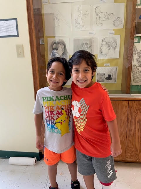 two children hugging for a photo